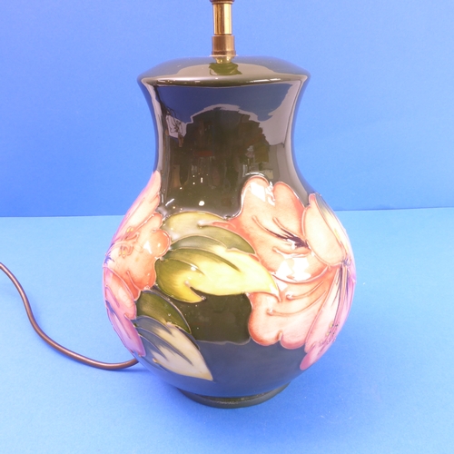 17 - A Moorcroft table lamp of Hibiscus pattern (24cm high x 18cm wide)