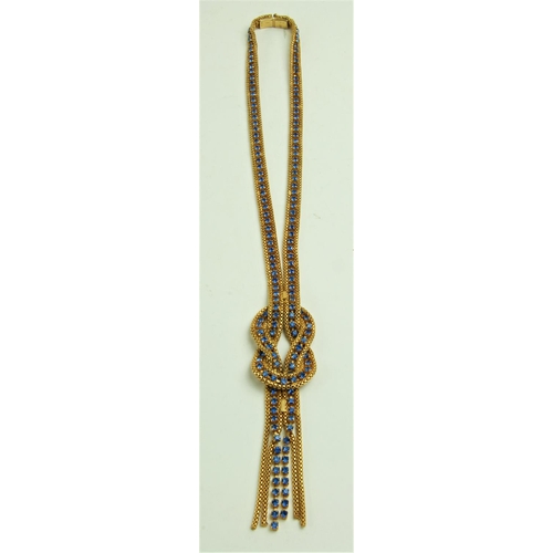 540 - An attractive Ladies gold coloured Necklace, of link design inset with multiple blue sapphire type s... 