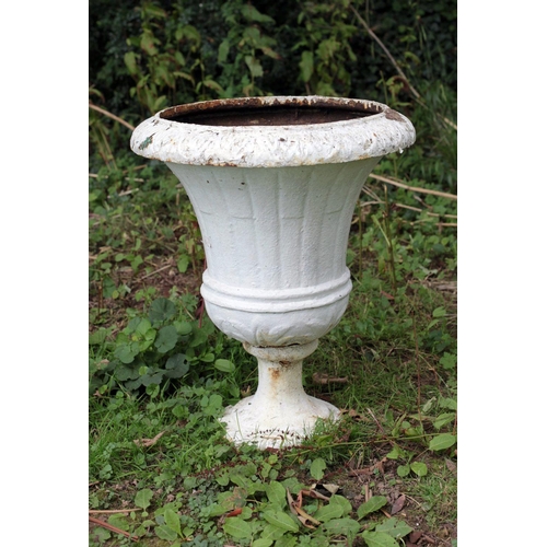 37 - A pair of Victorian cast iron tall finial Urns, on circular bases, each approx. 71cms (28