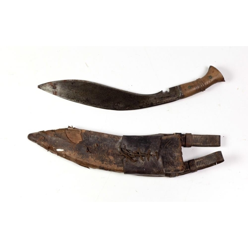 27 - An early 20th Century Kurkha, with shaped blade stamped 1915, with wooden handle and scabbard. (1)