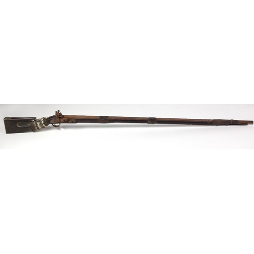 51 - An early Victorian Colonial long barrel flintlock Rifle, with leather banding, shell decoration, sta... 