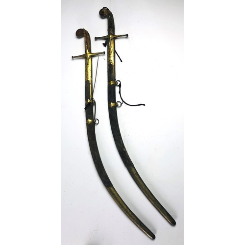 61 - An early 19th Century Indian Sabre, in an engraved brass and animal skin scabbard, signed with stamp... 