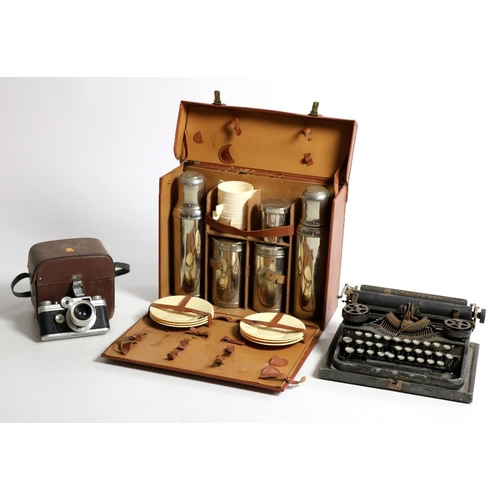 18 - A Picnic Case, furnished with tea service etc., two portable Typewriters, two old Cameras, Record Ho... 