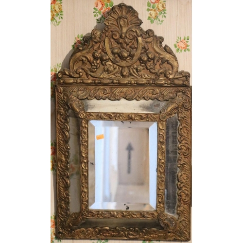 34 - A Victorian embossed brass cushion frame Wall Mirror, and a small attractive giltwood arch top Wall ... 