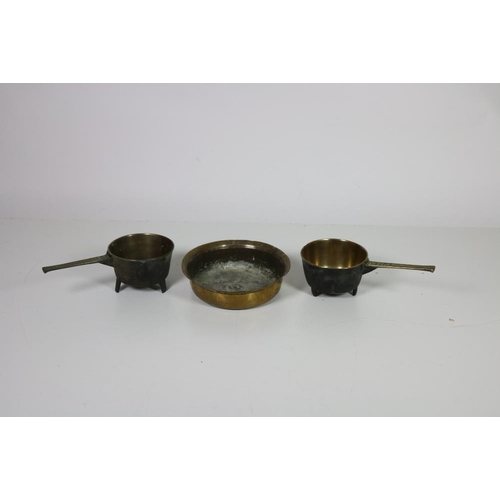41 - Two good heavy 19th Century bronze Skillet Pots, inscribed WH4 and 4PE, together with a large circul... 