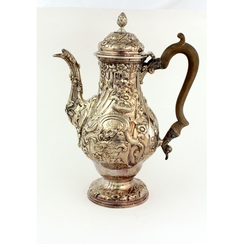44 - A very fine early George III heavy silver Coffee / Chocolate Pot, of baluster form with embossed dec... 