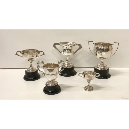 58 - Five varied two handled silver Trophy Cups, various sizes, mostly Dublin c. 1940's, 50s', including ... 