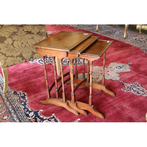 475 - A nest of three rectangular mahogany Occasional Tables, on turned supports, 19