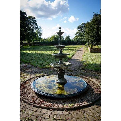 118 - A green painted four tier cast metal Garden Fountain, each pan with a tongue and dart folded edge on... 
