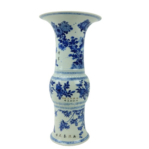 46 - A large important Kangxi period blue and white Gu Vase, 18th Century, decorated with birds and flowe... 