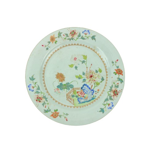 42 - An 18th Century Chinese Famille Rose Platter, decorated with colourful flowers, with fleur de lys gi... 