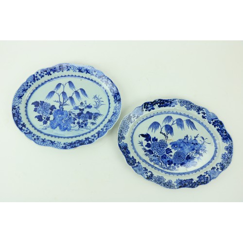 23 - A good pair of Kangxi blue and white Chinese oval Platters, with willow trees, 15 1/2