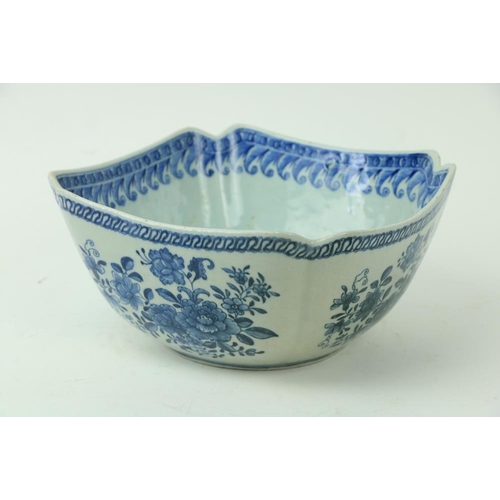 26 - A Chinese blue and white Nankin Bowl, of square form with re-entrant corners, decorated with floral ... 