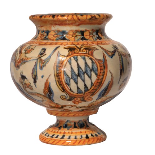 48 - An early Castelli Majolica bulbous Vase, of small proportions, decorated with winged figures, on cir... 
