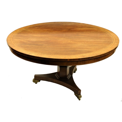 476 - A Regency period rosewood inlaid and crossbanded Breakfast Table, with circular flip top raised on a... 