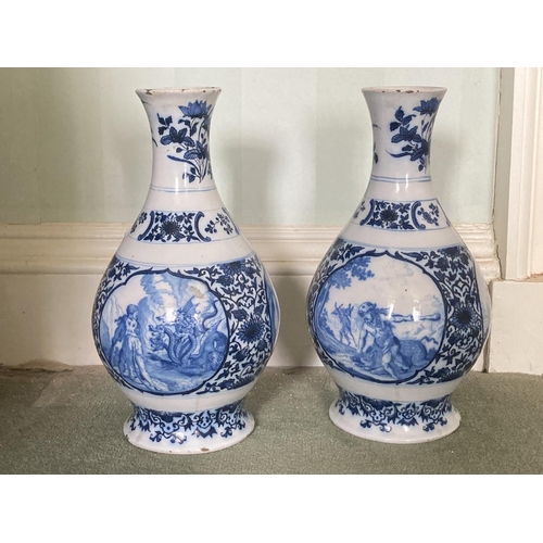525 - A fine pair of blue and white early 18th Century Delft Vases, each decorated with hunting scenes and... 