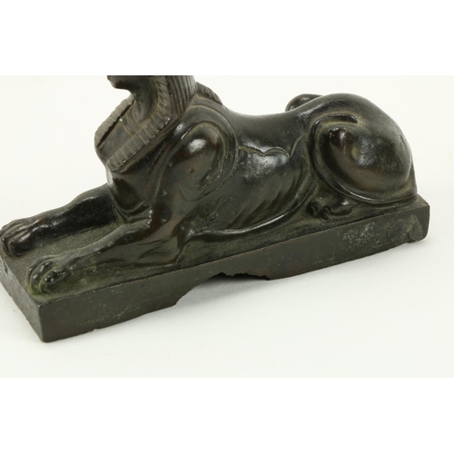11 - A pair of small bronze Desk Figures, modelled as Sphinx, a small heavy brass Desk Clock, the dial si... 