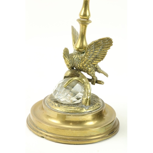 28 - A small attractive Art Nouveau bronze Desk Oil Lamp, modelled with a cherub on a leaf, with glass oi... 