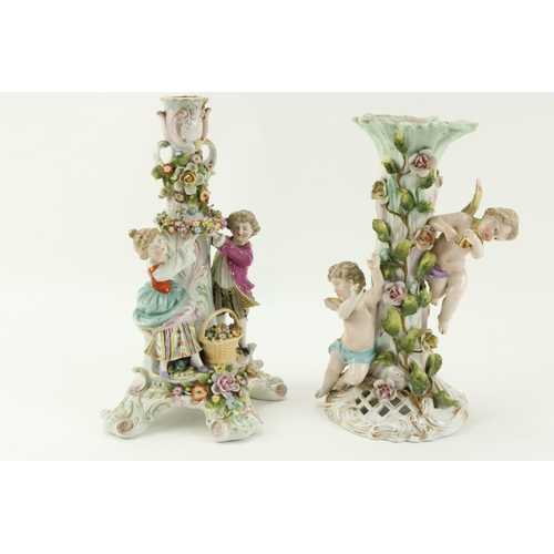 38 - A Sitzendorf porcelain Table Lamp, with flowers and two cupids surmounted; and a Sitzendorf Centerpi... 