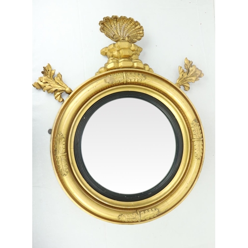 4 - An Irish Georgian giltwood circular convex Overmantel Mirror, in the manner of Del Vecchio, with car... 