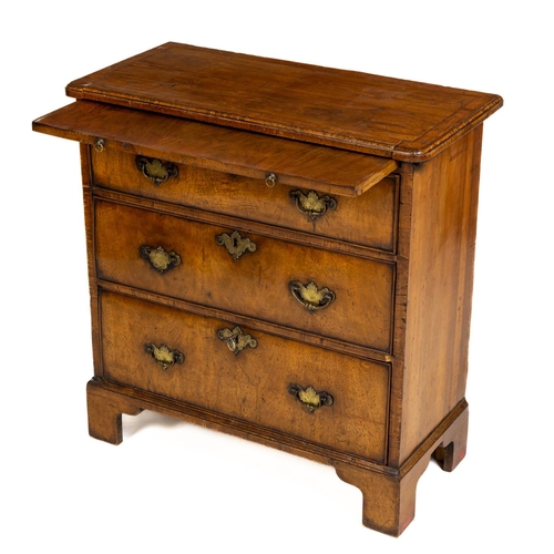 11 - A fine quality walnut Chest, 18th Century and later, the segmented top with herring bone inlay and m... 