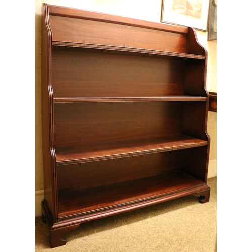 3 - A pair of Georgian style stained Waterfall Bookcases, with shaped sides on plinth bases with bracket... 