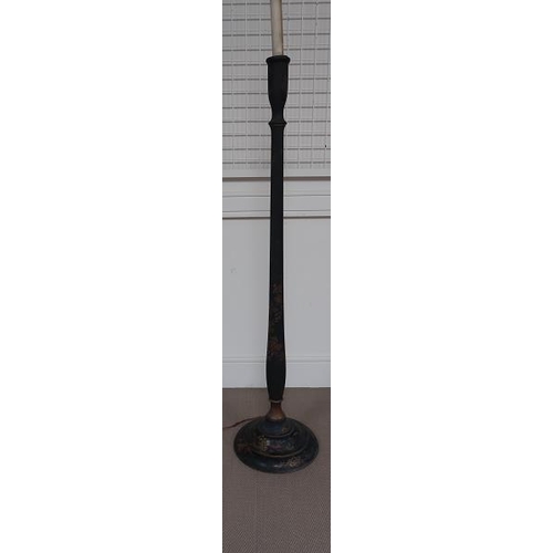 42 - A Victorian black lacquer standard lamp on ciruclar base.