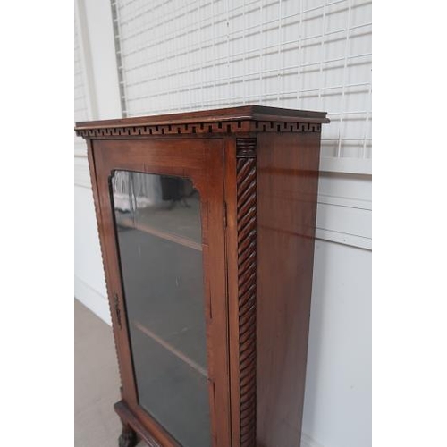 44 - A Victorian mahogany single door display cabinet, rope twist sides raised on bun feet, 50 cms wide, ... 