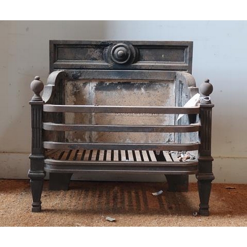5 - A cast iron bow front fire basket centred by a roundel, 60 cms wide, 58 cms high.