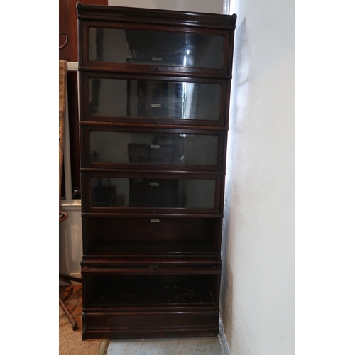1 - Correction: A Globe Wernika oak six  section bookcases, (one glass door missing).198 cms high, 88 cm... 