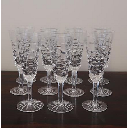 A set of eleven Waterford crystal Tralee pattern champagne glasses.
