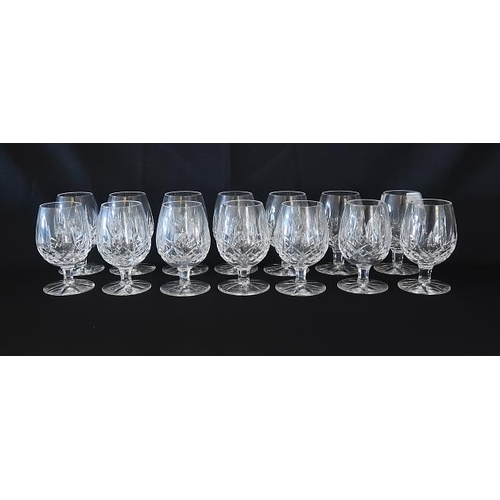 10 - A set of fourteen Waterford crystal small brandy glasses, height 11.5 cms.