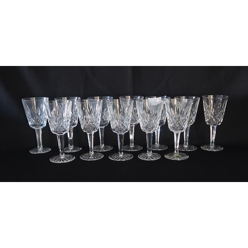 11 - A set of twelve Waterford crystal wine glasses, height 14 cms.