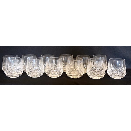 14 - A set of fourteen Waterford crystal whiskey tumblers, height 7.5 cms.