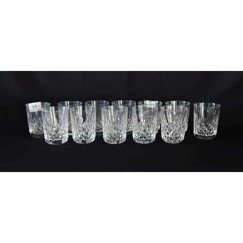 19 - A collection of twelve Waterford cryatal small whiskey tumblers, height 9 cms.