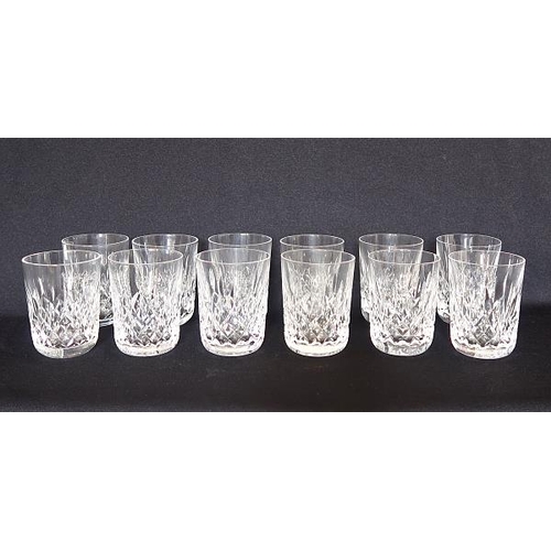 21 - A set of twelve Waterford crystal whiskey tumblers, height 9 cms.