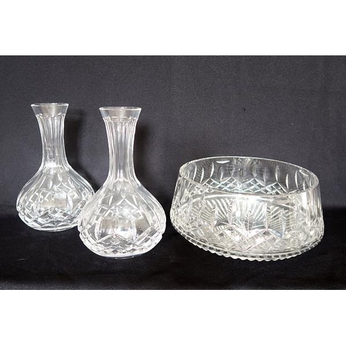 22 - Two Waterford crystal decanters, height 22 cms and a Waterford crystal bowl, 21 cms diameter.