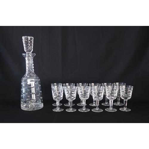 29 - A Waterford crystal Tralee pattern decanter and stopper, height 33 cms. & a set of twelve Waterford ... 