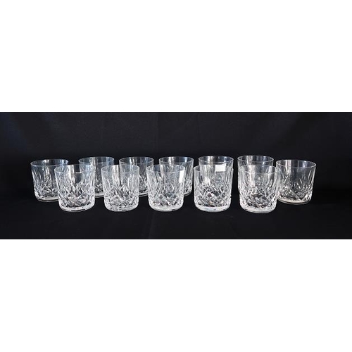 33 - A set of twelve Waterford crystal whiskey tumblers,height 9 cms.