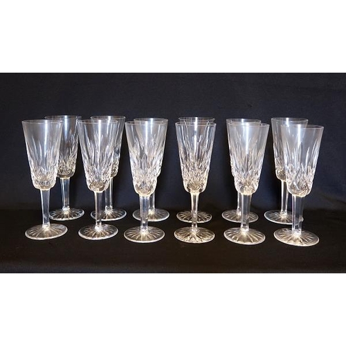 4 - A Collection of twelve Waterford crystal champagne flutes, height 19 cms.