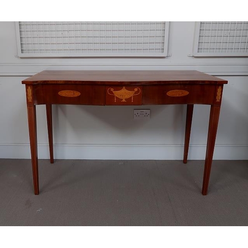 44 - A 20th Century Sheraton Revival inlaid mahogany serpentine side table,the frieze inlaid with classic... 