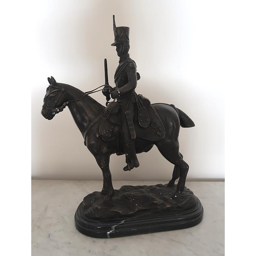 45 - John Skeaping, a bronze figure of a cavalry officer on horseback, 43 cms high, 30 cms long.