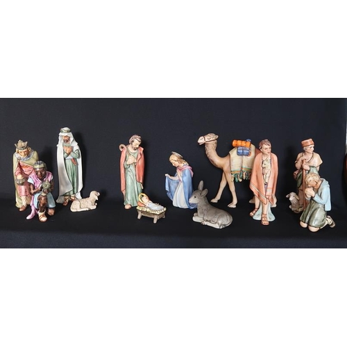 48 - A Vintage Hummel thirteen piece Nativity Set, 8 - 23 cms high with stand, together with a Hummel fig... 