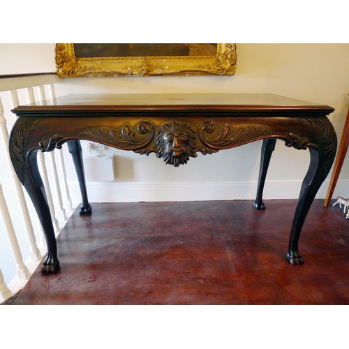 52 - An Irish 19th Century mahogany hall table, the rectangular top above lion mask carved freize, raised... 