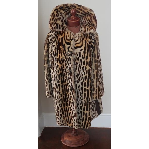 55 - A faux oselot wool coat, 88 cms long, sleeve 60 cms long.