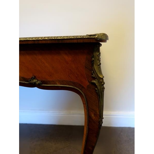 59 - A French early 19th Century walnut and kingwood centre table, with frieze drawer, on ormolu mounted ... 