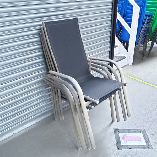 21 - Four stackable metal garden patio chairs.