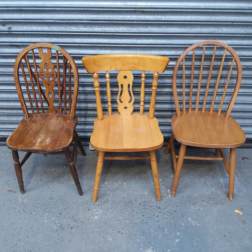 49 - Three wooden kitchen chairs.