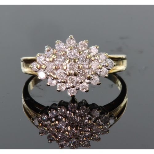 38 - 9ct yellow gold diamond cluster ring consisting of twenty five round brilliant cut diamonds totallin... 