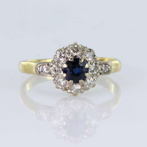 42 - 18ct yellow gold cluster ring comprising a central round sapphire measuring approx. 5mm, surrounded ... 